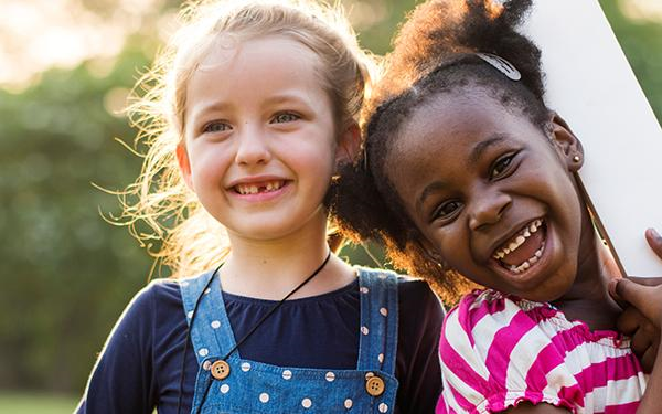 two girls smiling